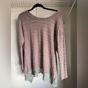 A reve open back bow sweater size medium